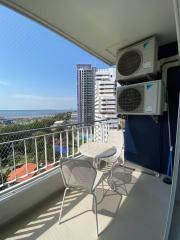 Cozy balcony with outdoor seating and ocean view