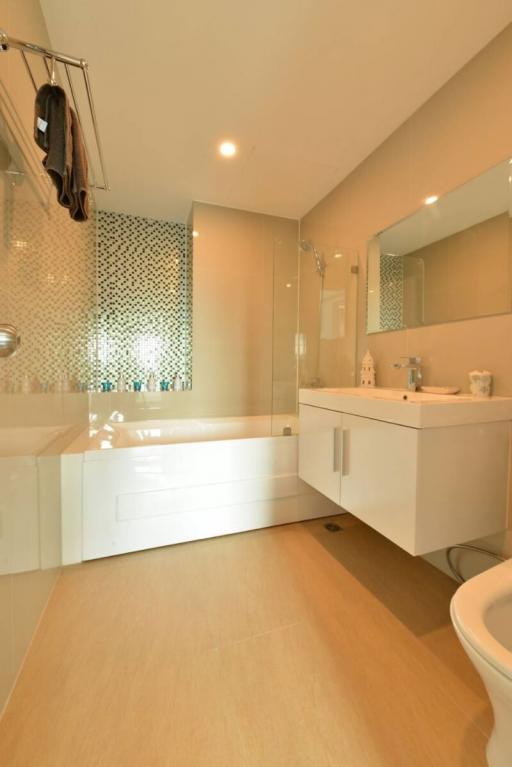 Modern bathroom with glass shower and white vanity