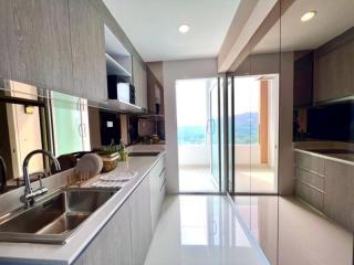 Modern kitchen with stainless steel appliances and a scenic view