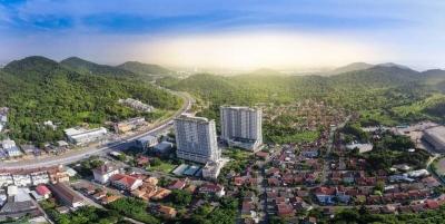 Aerial view of a residential area with high-rise buildings and lush greenery