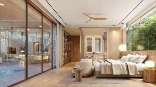 Modern bedroom with large sliding glass doors opening to a patio area