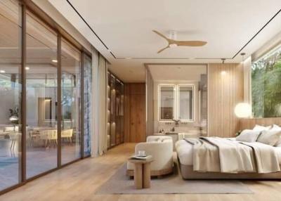 Modern bedroom with large sliding glass doors opening to a patio area
