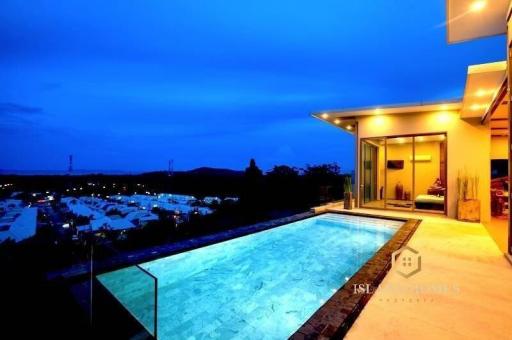 Luxurious poolside with scenic view at dusk