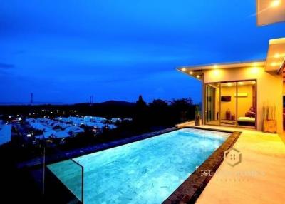 Luxurious poolside with scenic view at dusk