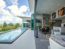 Spacious living area with open layout connecting to a swimming pool and offering a panoramic view