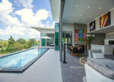 Spacious living area with open layout connecting to a swimming pool and offering a panoramic view
