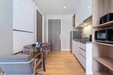 Modern kitchen with dining table in a bright apartment