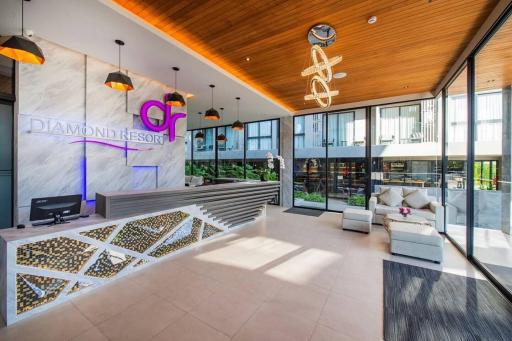 Modern lobby interior of Diamond Resort with reception desk and comfortable seating area