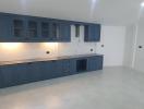 Modern kitchen with blue cabinets and clean design