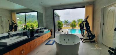 Modern bathroom interior with a view of an outdoor pool