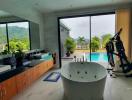 Modern bathroom interior with a view of an outdoor pool