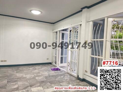 Empty room with tiled floor and large windows