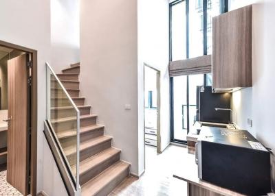 Modern interior with staircase and kitchen view in a new building