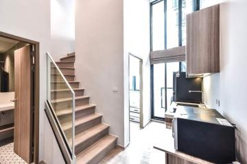 Modern interior with staircase and kitchen view in a new building