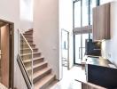 Modern interior with staircase and kitchen view in a new building