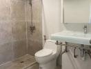 Modern bathroom with walk-in shower and floating sink