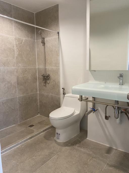 Modern bathroom with walk-in shower and floating sink