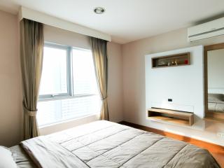 Cozy bedroom with natural light and modern decor