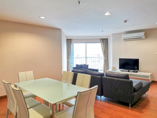 Spacious living room with dining area and modern furniture