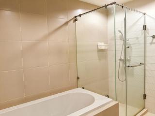 Modern bathroom with a clean bathtub and shower unit