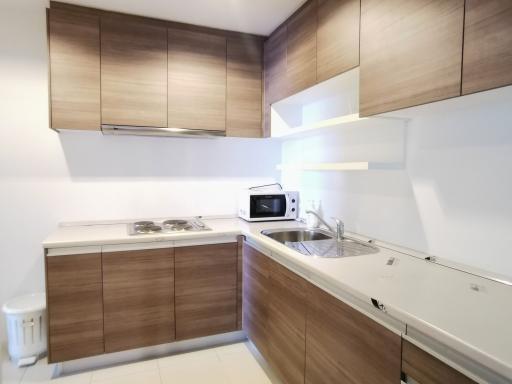 Modern kitchen with wooden cabinets and white countertops