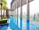 Modern rooftop swimming pool overlooking the city skyline