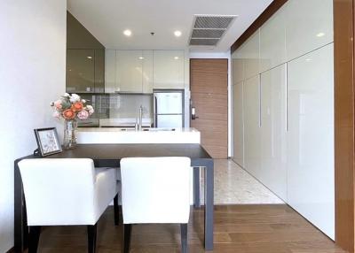 Modern kitchen with dining area and wooden accents