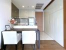 Modern kitchen with dining area and wooden accents