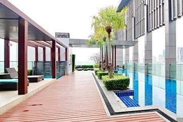 Modern rooftop terrace with pool and lounge area