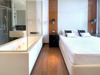 Modern bedroom with en-suite bathroom and wooden floor