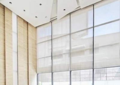 Spacious and Modern Building Lobby with High Ceiling and Floor-to-Ceiling Windows