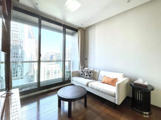 Modern living room with large windows and city view