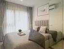 Elegant modern bedroom with neutral tones and natural lighting