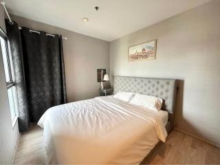 Cozy bedroom with natural lighting and wooden floor