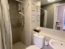 Modern bathroom with walk-in shower and white ceramics