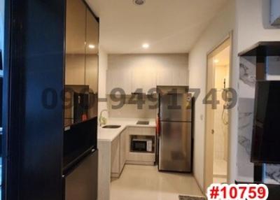 Modern kitchen with stainless steel appliances and white cabinets