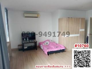 Spacious bedroom with wooden wardrobe and air conditioning