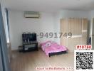 Spacious bedroom with wooden wardrobe and air conditioning