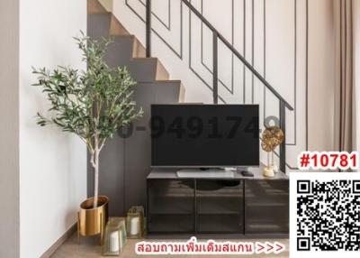 Modern living room interior with television and staircase