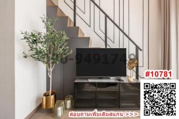 Modern living room interior with television and staircase