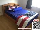 Cozy bedroom with a single bed and American flag-themed bedding