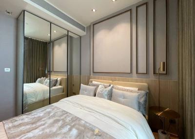 Elegant modern bedroom with a large bed and tasteful decor
