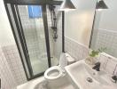 Modern bathroom with black fixtures and walk-in shower