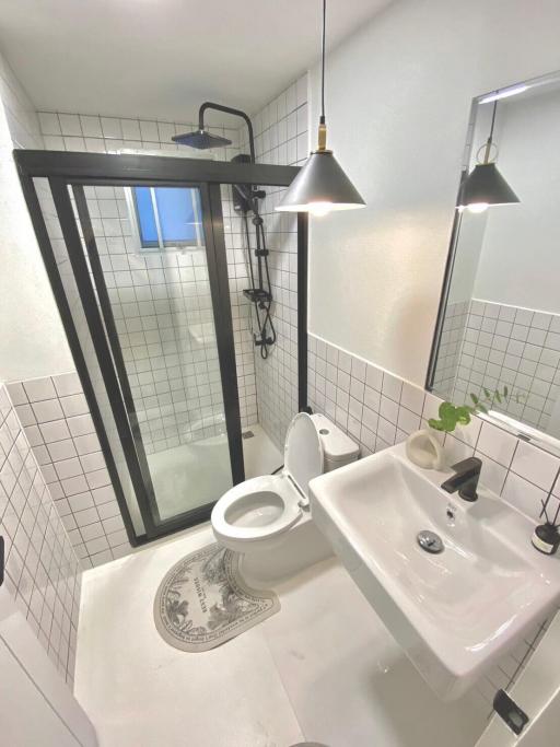 Modern bathroom with black fixtures and walk-in shower