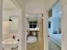 Hallway view towards bathroom and bedroom in modern home