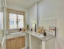 Bright modern kitchen with white tiles and wooden cabinetry