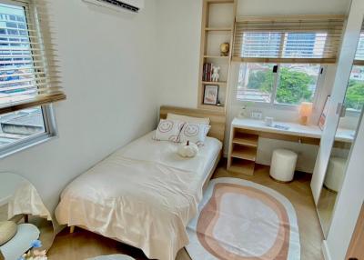 Cozy and well-lit bedroom with modern amenities