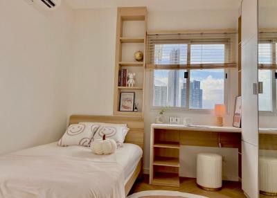 Cozy bedroom with natural light and city view