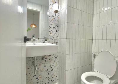 Modern white bathroom with terrazzo flooring