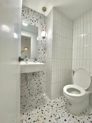 Modern white bathroom with terrazzo flooring